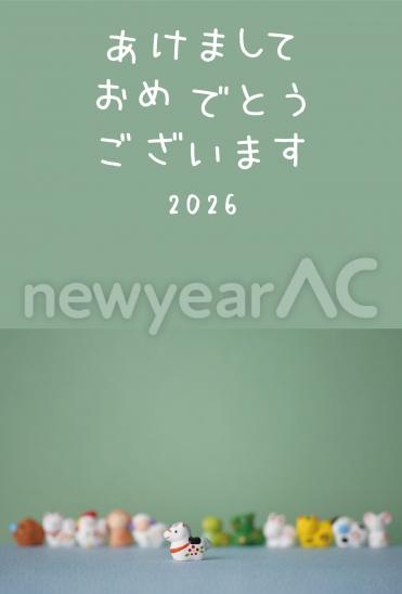 緑背景の干支人形年賀状